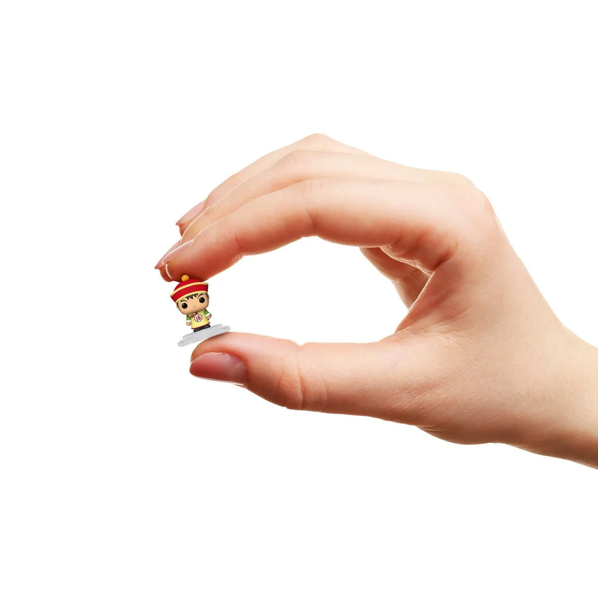 Hand holding a Funko Bitty Pop Gohan white background