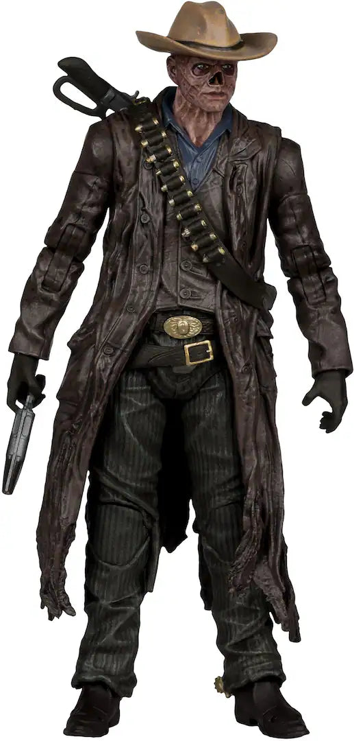 Action figure in a dark, worn-out outfit with a hat and weapon on a white background