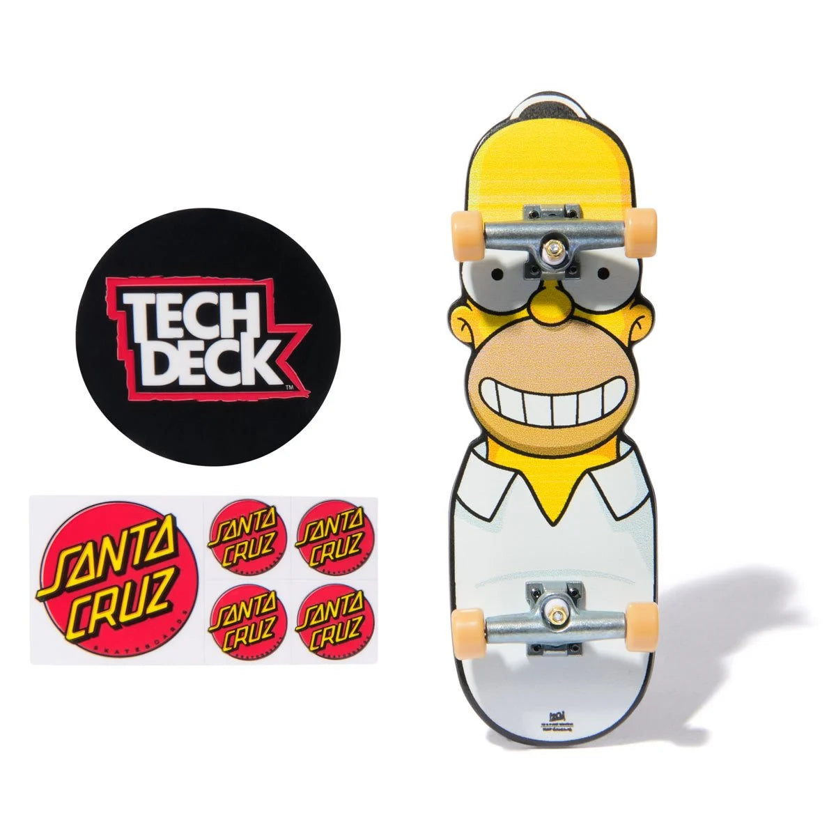 Skateboard with Homer Simpson design, Tech Deck logo, and Santa Cruz stickers on a white background