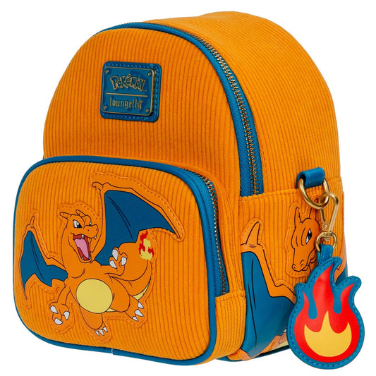 Angled front view of Charizard mini‑backpack showcasing orange corduroy, embroidered Charizard features and removable flame charm.