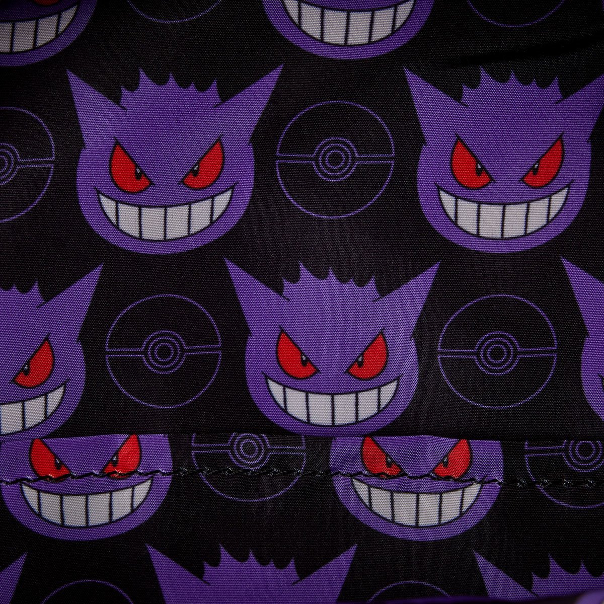 Pattern of Gengar Pokemon with red eyes and a black background featuring Poke ball.