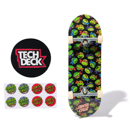 Skateboard deck with Teenage Mutant Ninja Turtles design, Tech Deck logo, and Santa Cruz stickers on a white background